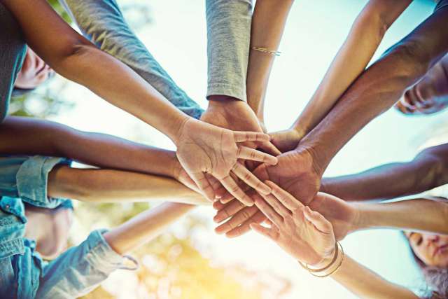 Group of hands in a huddle