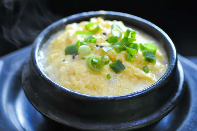 Bowl of Korean steamed eggs topped with green onions