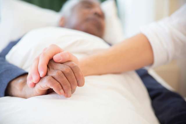 Older man in hospital bed