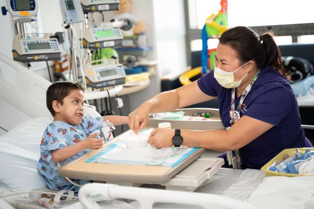 Child life specialist with a patient