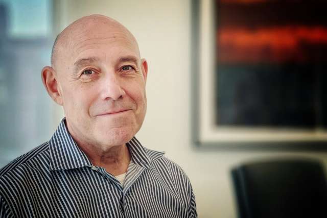 Photo of Dr. Mark S. Litwin in striped shirt in an office headshot.