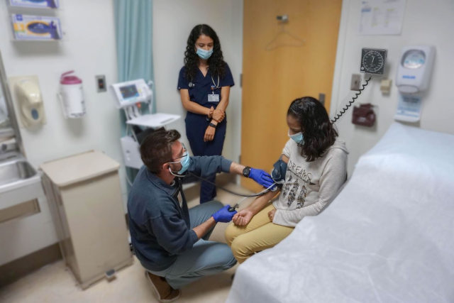 Doctor examining patient