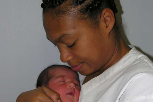 Newborn and African-American woman