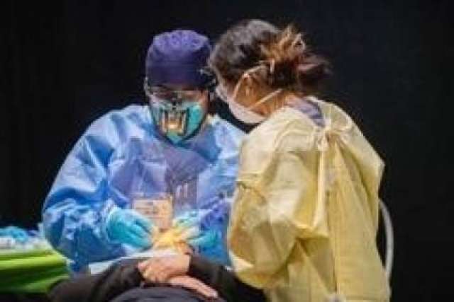 A patient receives dental work at the Care Harbor clinic