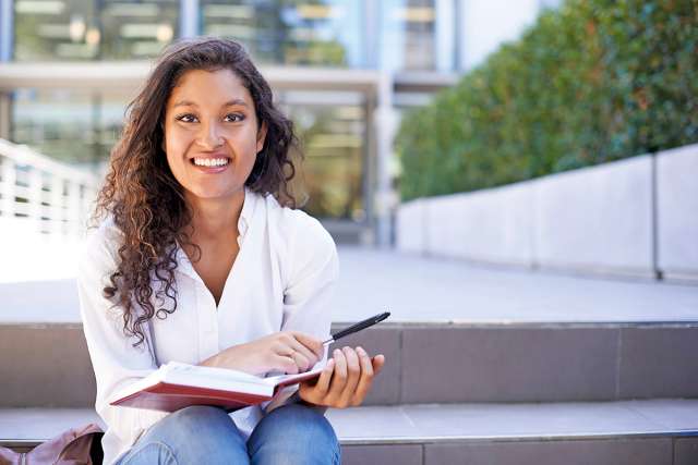 College Student reading a book