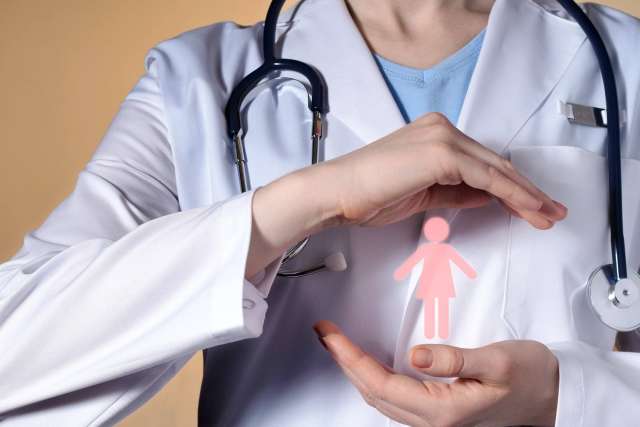 Hands of a doctor specializing in Postpartum Pelvic Floor Health