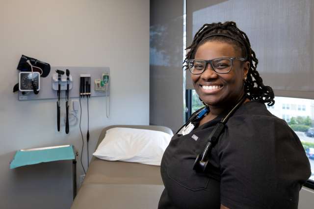 Black female doctor in examination room