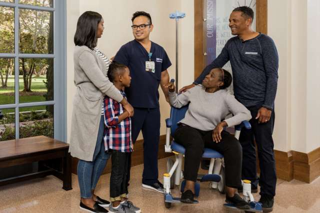 A doctor helping a family through a loved-ones recovery.