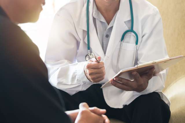 Doctor speaking to patient