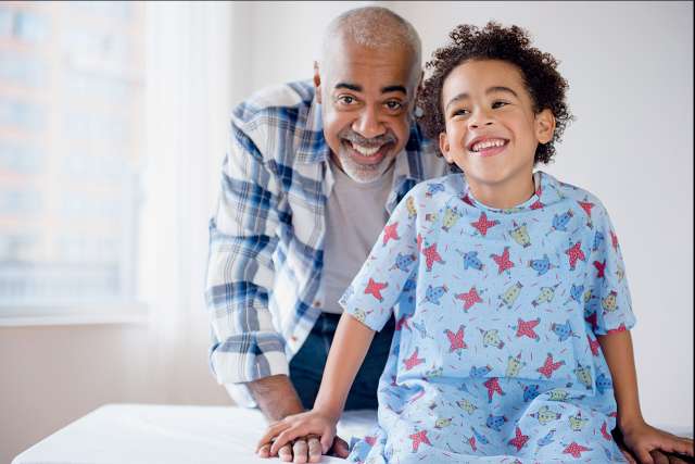 Father and child smiling