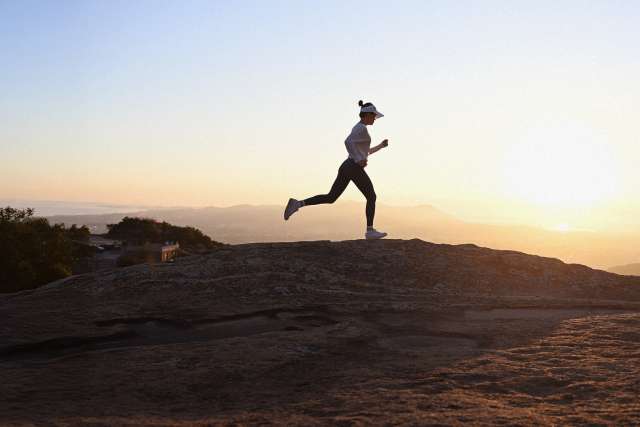 runner with sunset in back