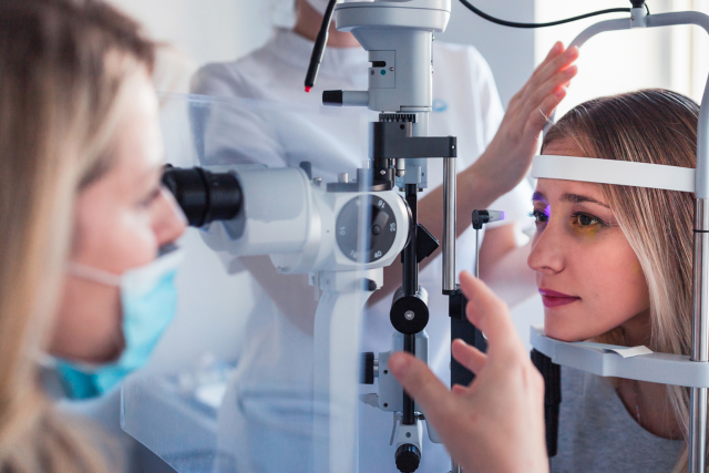 Woman getting eye exam