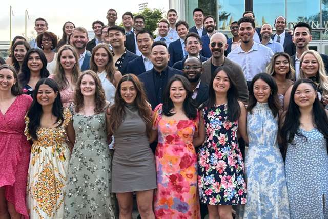 Large group of Internal Medicine Residents in front of Pauley Pavilion
