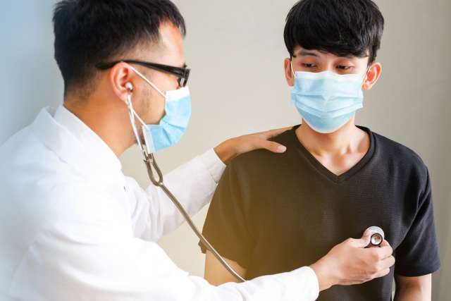 Doctor and adolescent patient