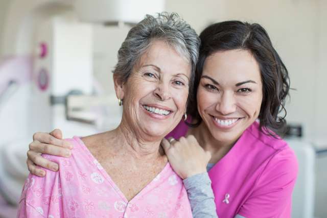 Physician and patient wearing pink
