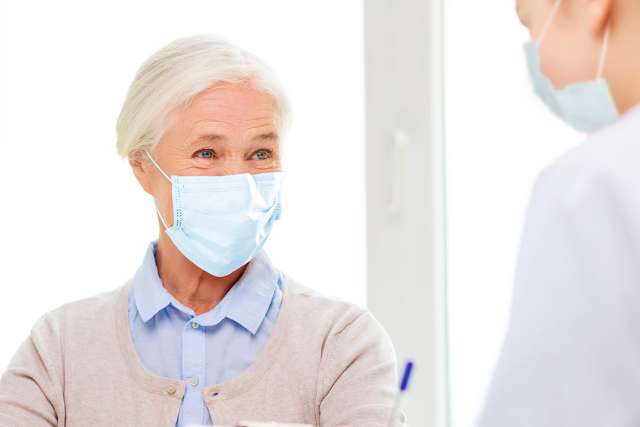 Senior woman consulting with doctor