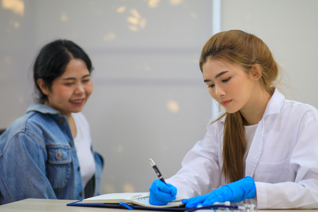 a female doctor meeting with a female patient during a doctor's visit