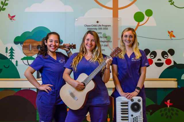 Child life specialists at UCLA Health hold instruments used in music therapy to support young patients.