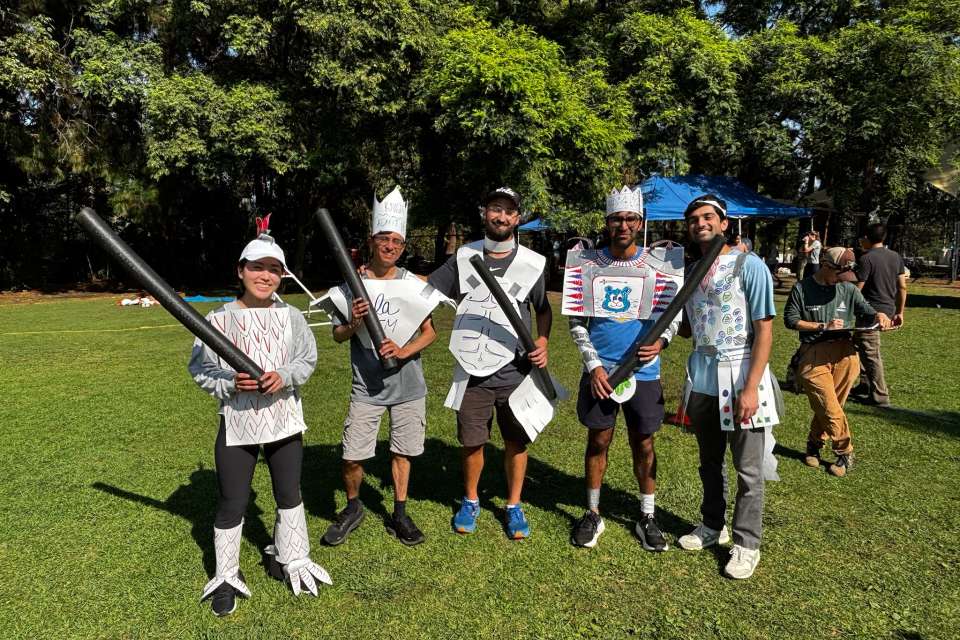 Internal Medicine Residents on grass, wearing paper armor and crowns