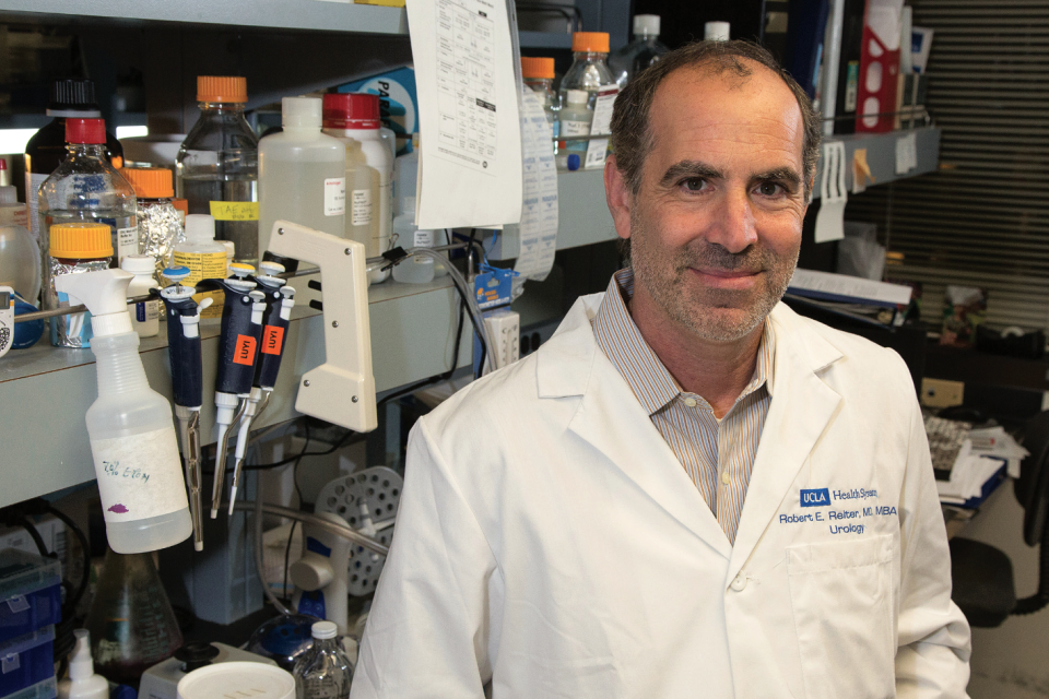 Dr. Robert Reiter, Principal Investigator of the UCLA SPORE in Prostate Cancer, standing in a laboratory setting with research equipment