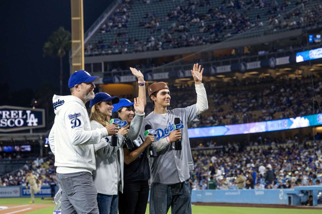 Josie Le Blanc and her family wave to the crowd at Dodger Stadium when they announce, "It's time for Dodger baseball."