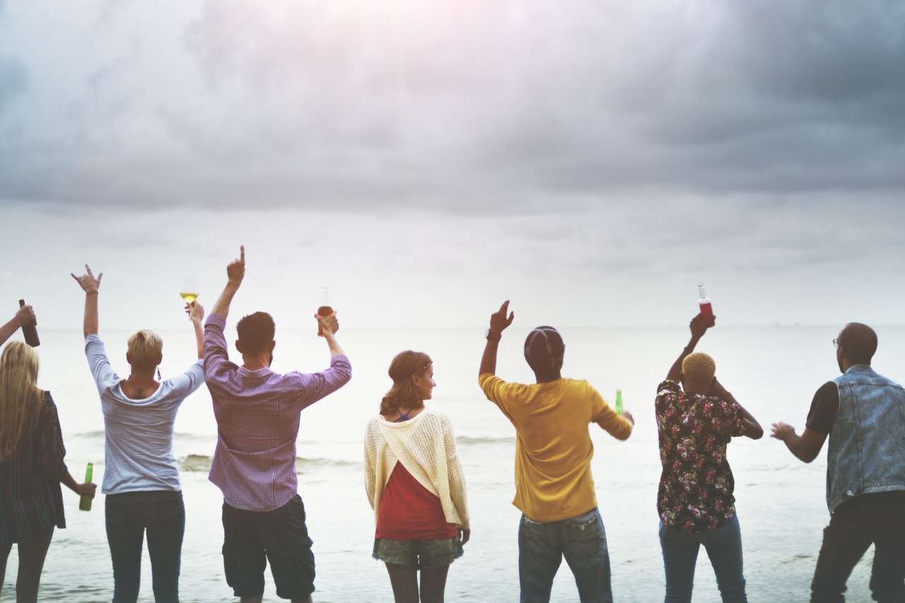 Cancer patients standing together on the beach