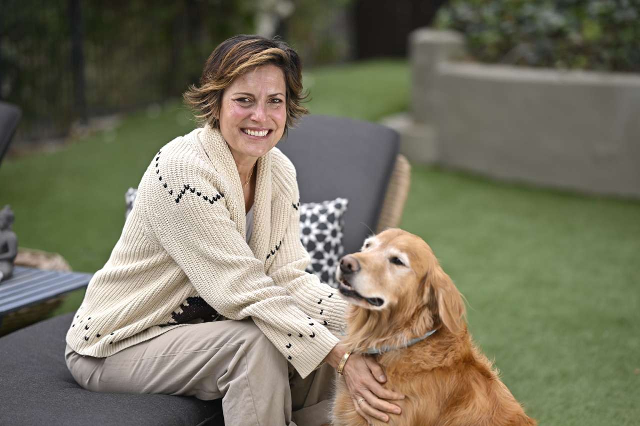 Melanie Shatner Gretsch poses for a photo with her dog