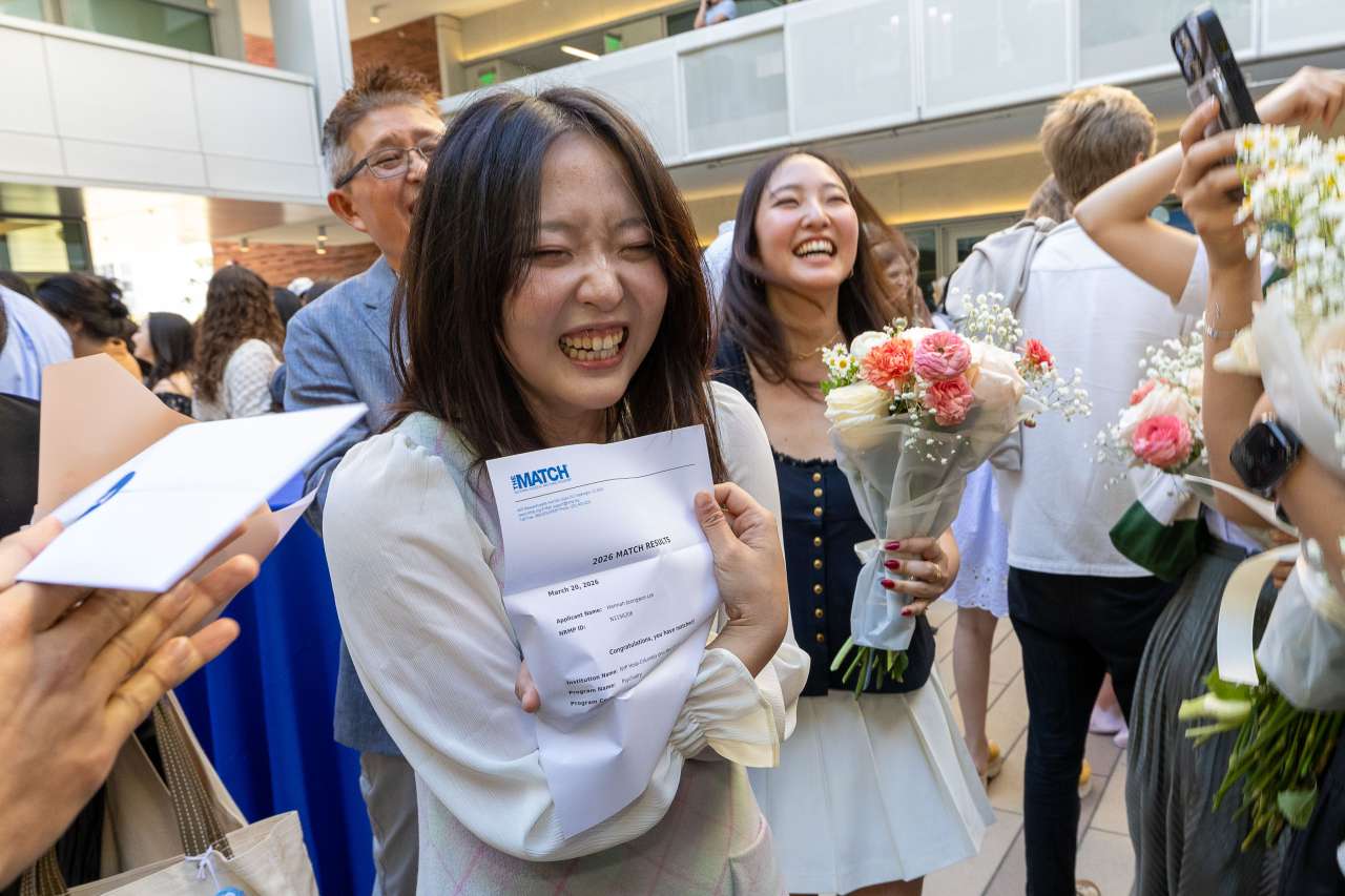 UCLA medical student Hannah Lee celebrates her match in the quad of Geffen Hall at UCLA.