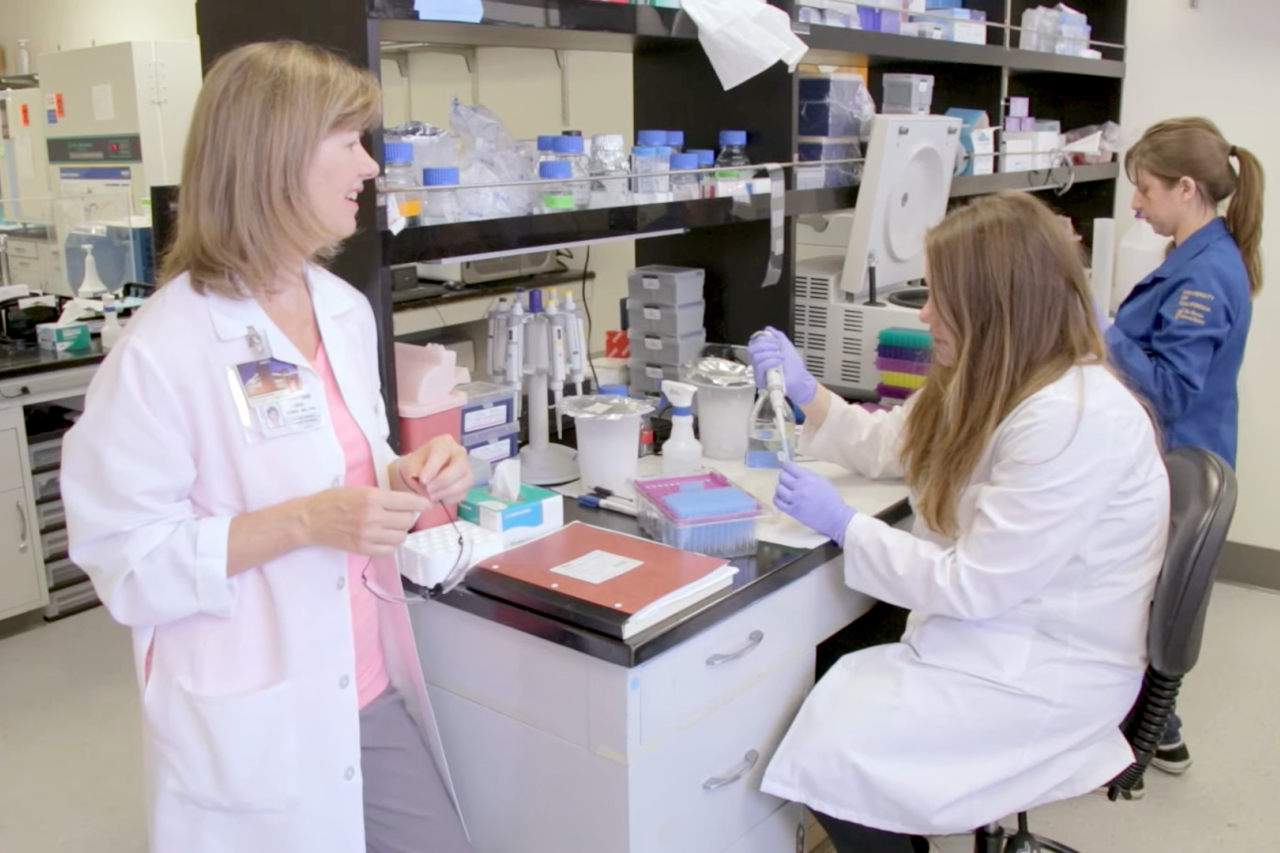 Dr. Demer and two physician scientists working in a lab.