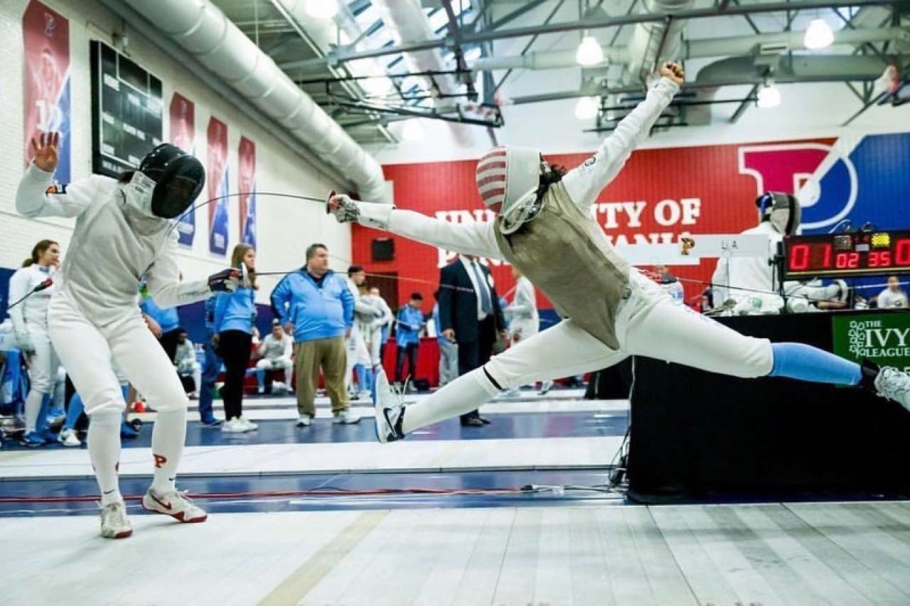 A fencer lunges during competition.