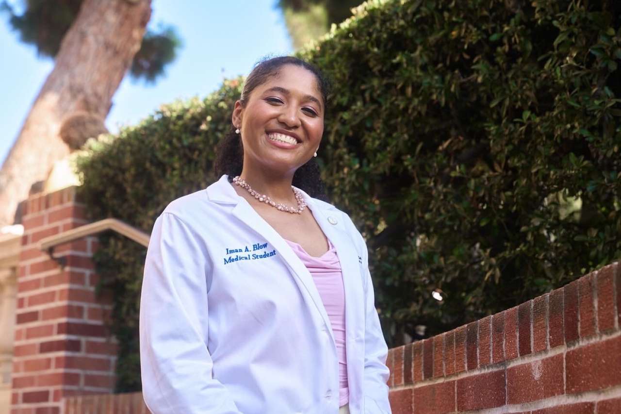 Portrait of medical student in white coat.