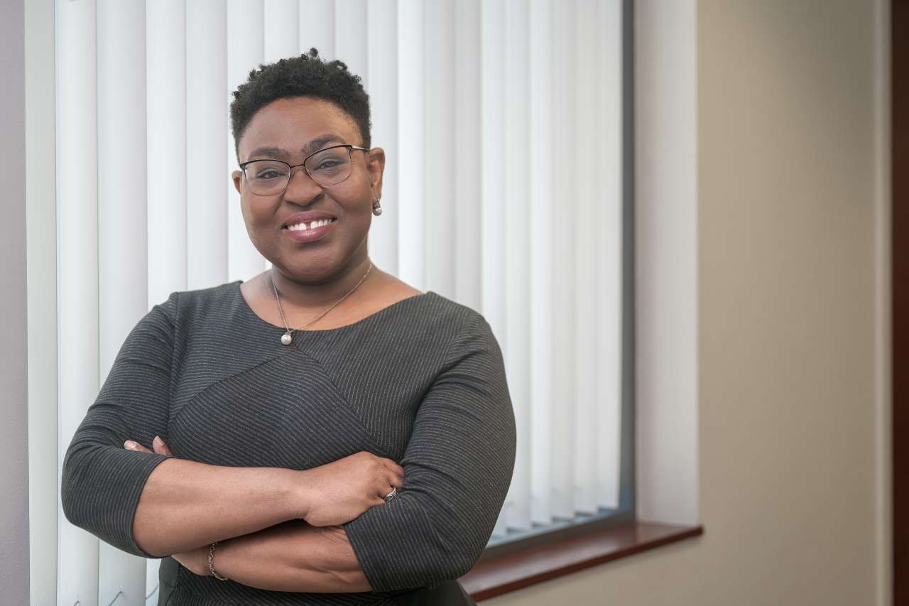 Kemi Reeves crossing her arms and smiling