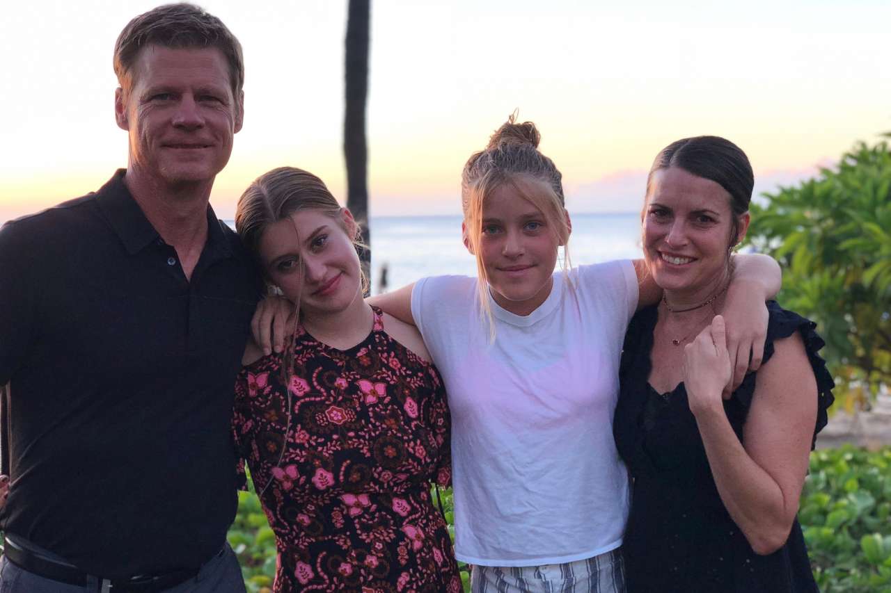 Melanie Shatner Gretsch, her husband and their two daughters pose for a photo with the ocean in the background