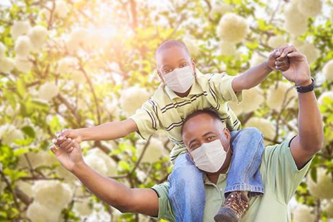 Father with son on his shoulders