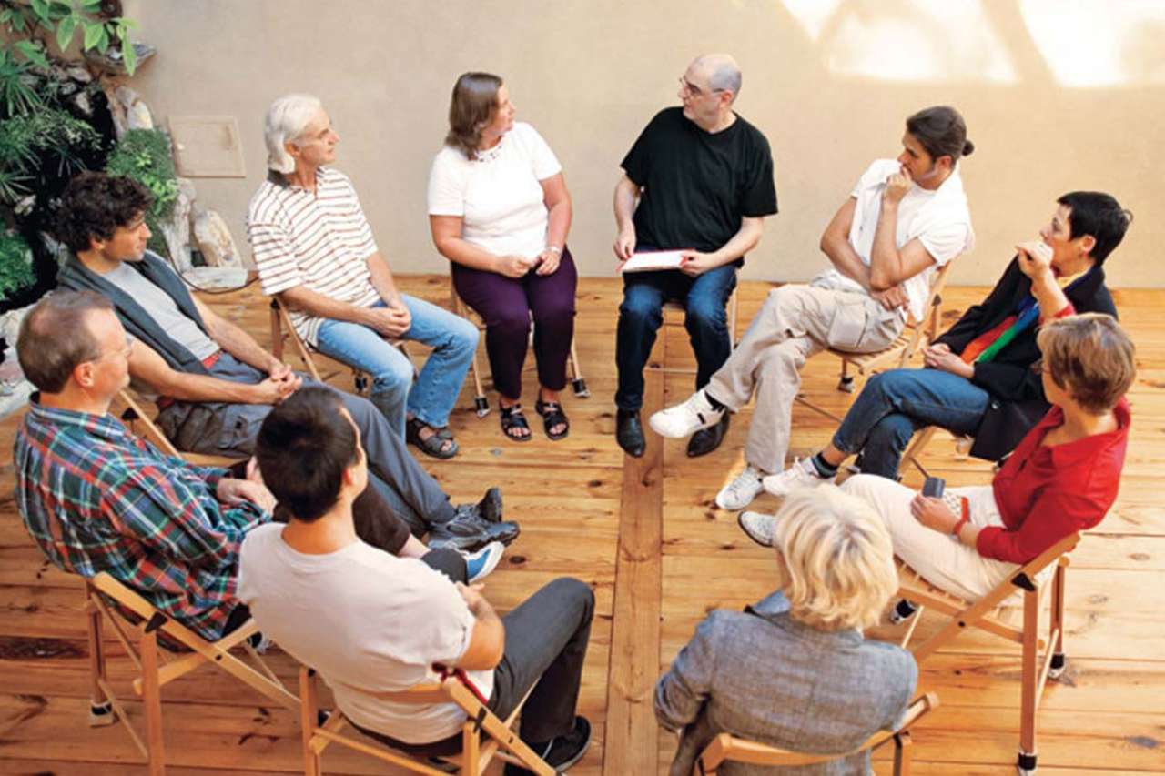 Group of people seated in a circle