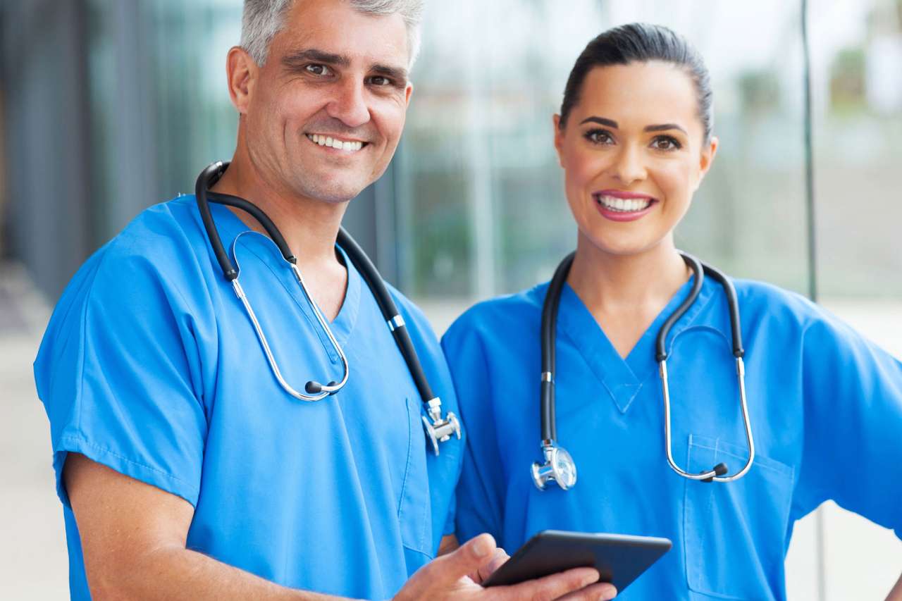 Medical doctors using tablet pc in hospital