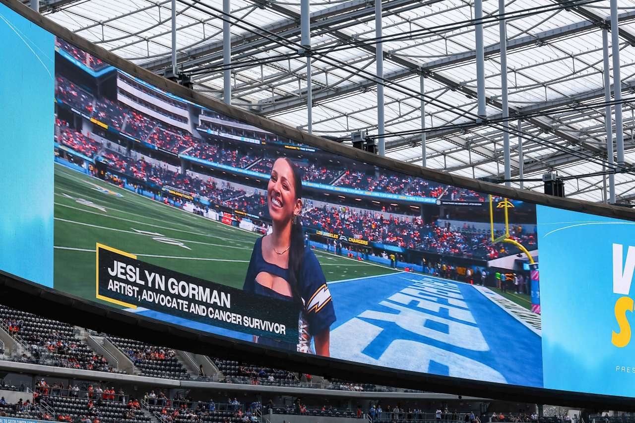 Jeslyn Gorman, a breast cancer survivor and advocate, is shown on the big screen at SoFi Stadium.