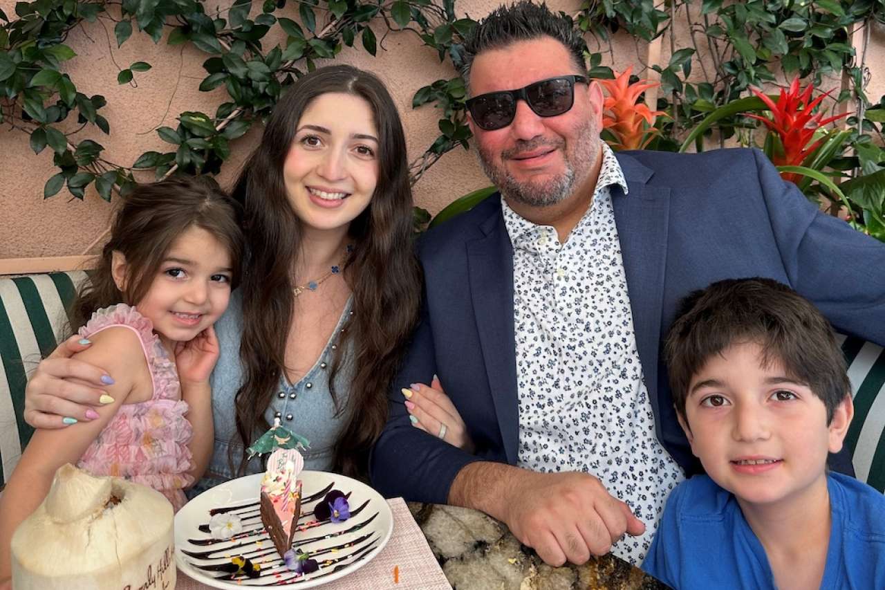 Family photo of mother, father, girl and boy