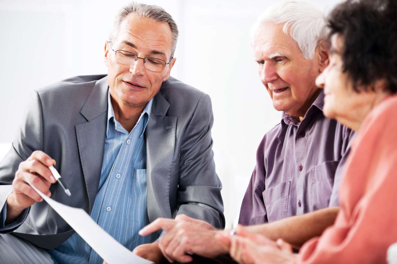 Senior couple talking with a specialist