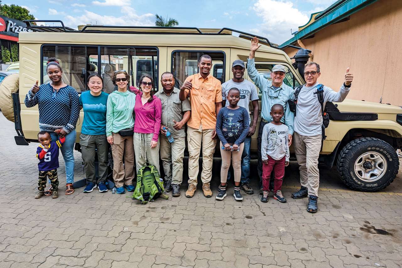 Dr. H. Albin Gritsch (second from right) with members of his safari group after the climb on Mt. Kilimanjaro, including guide Stanley Mariki (third from right) and his children and wife, Einoth (left).