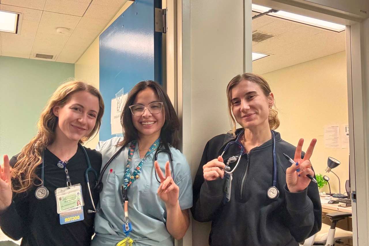 Primary care residents smiling in the hospital