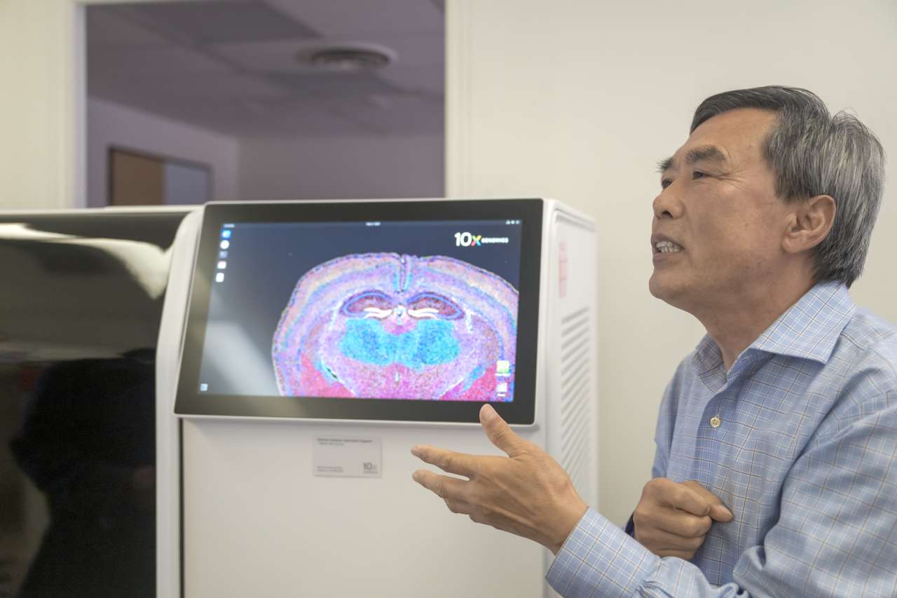 Man in front of computer screen in lab