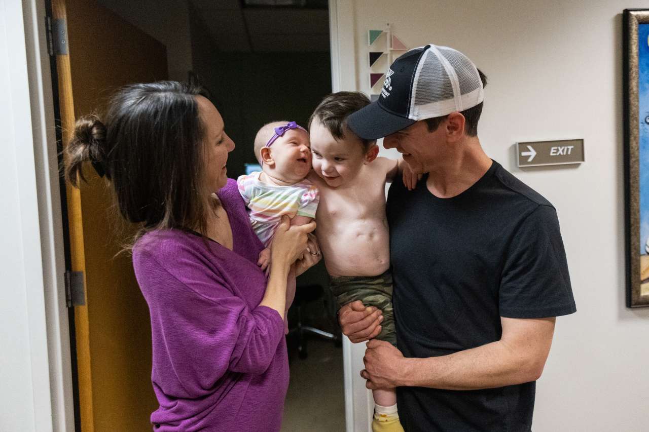 Liam with his sister and parents.