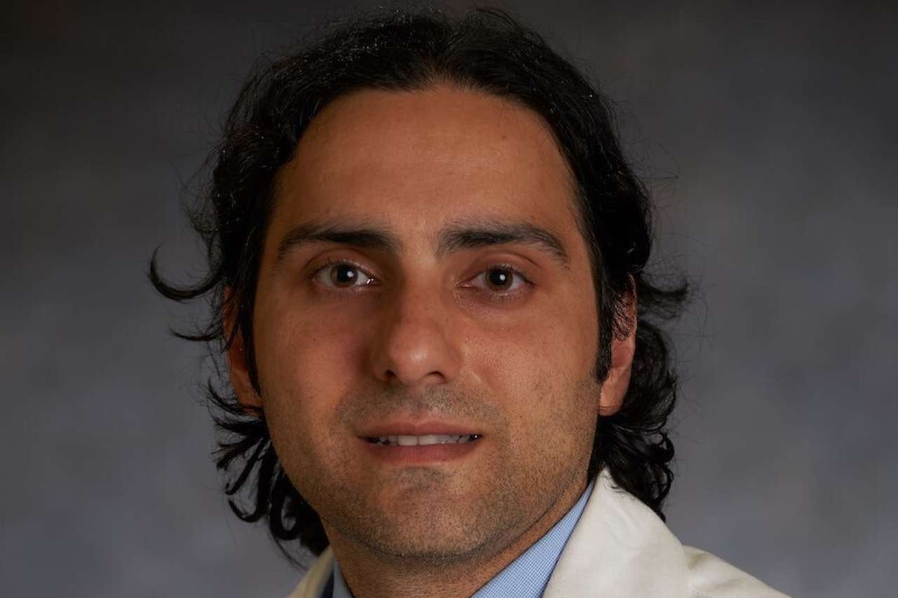 Boback Ziaeian, MD, PhD headshot wearing a white coat and tie