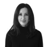 headshot of Susan Levine, who is wearing a black turtleneck