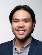 headshot of Gabriel Sanchez in blue suit