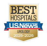 Gold badge with "Best Hospitals" at the top, a blue ribbon with "U.S. News & World Report," and "Urology 2025-2026" below.