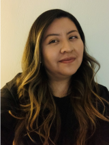 Kelly in front of a white background.