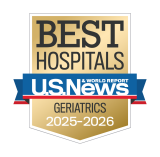 Gold badge with "Best Hospitals" at the top, a blue ribbon with "U.S. News & World Report," and "Geriatrics 2025-2026" below.