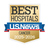 Gold badge with "Best Hospitals" at the top, a blue ribbon with "U.S. News & World Report," and "Cancer 2025-2026" below.